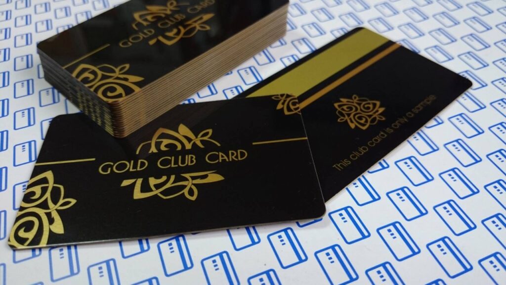 Club card with gold print on black plastic with golden edges